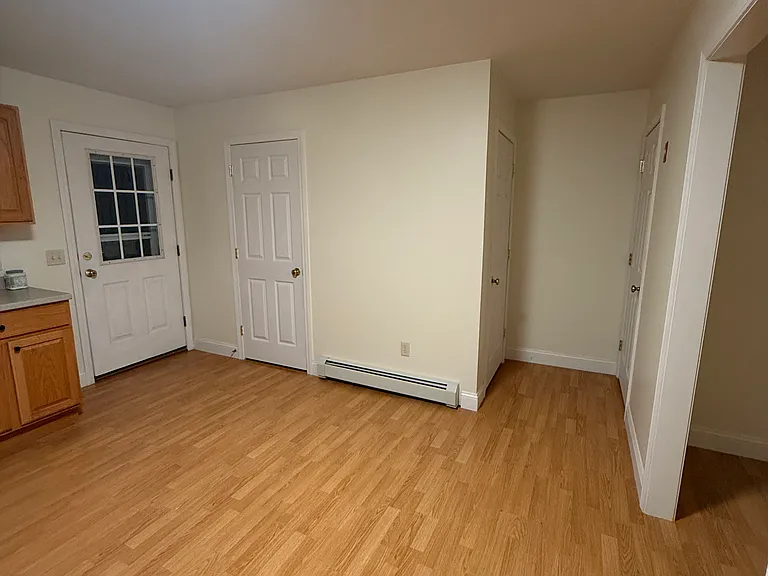 Kitchen with a view of your back door & 1/2 bathroom off the kitchen