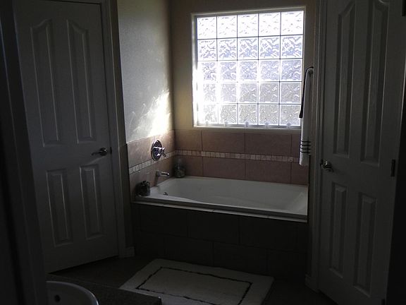 Master bathroom with his/hers walk-in closets and jetted tub