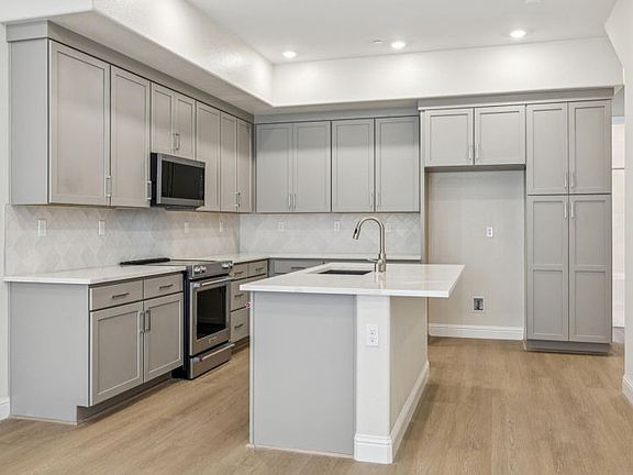 Kitchen with grey shaker cabinetry