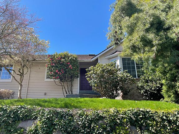 View of this home from the sidewalk down below. Front lawn space is perfect for a picnic on the grass or even a short nap!