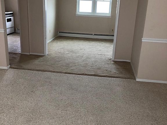 View from Living Room: Dining Area (Right) and Kitchen (Left)