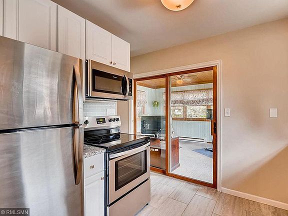 Kitchen w/ view of sunroom