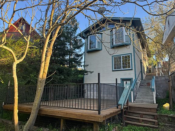 Rear exterior view of the cottage with spacious deck.