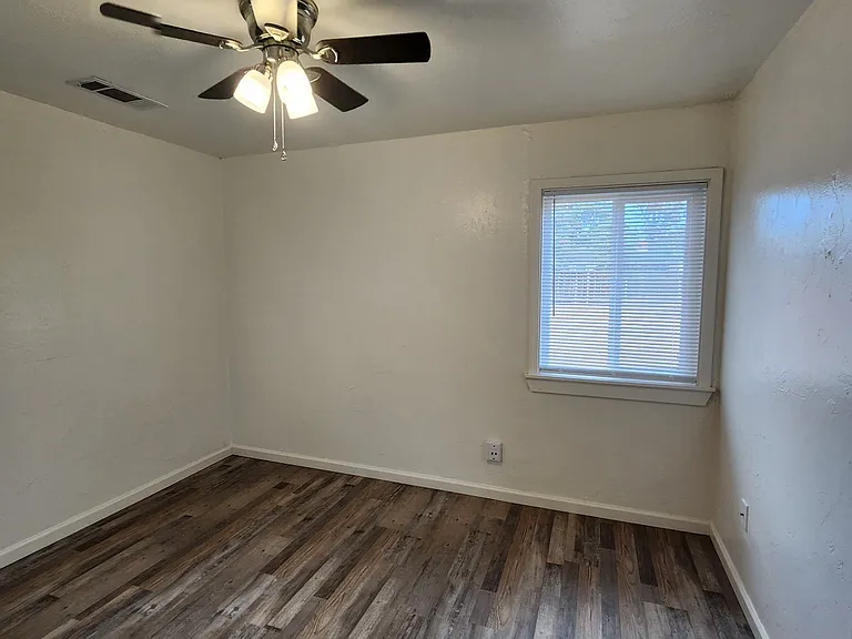 Bedroom 2 with ceiling fan.