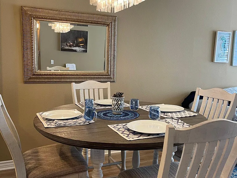 Dinning table with chandelier that gives this Villa an elegant touch.