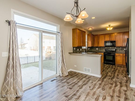 Patio doors in the Eating Area open to the yard.