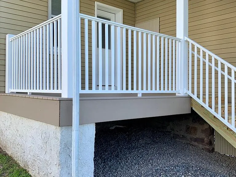 Rear covered porch with new decking and railings