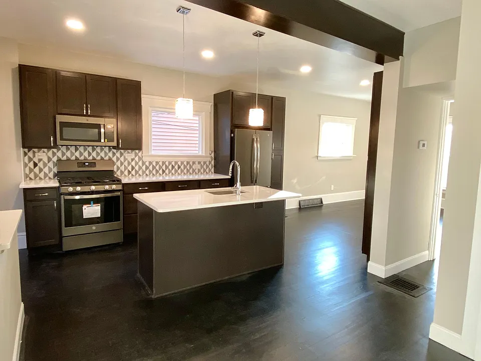 Custom marble backsplash, crystal pendant lighting