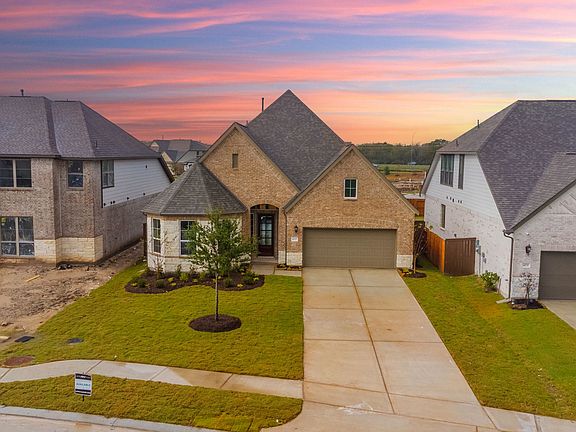 Welcome home to 4027 Martin Ridge Drive featuring a spacious front and back yard
