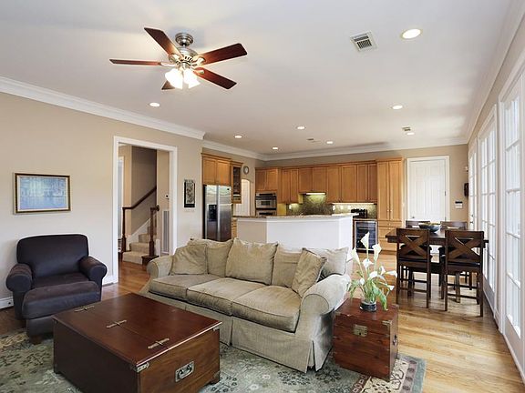 Another view of the family room showcases the high ceiling, and openness of the living area.