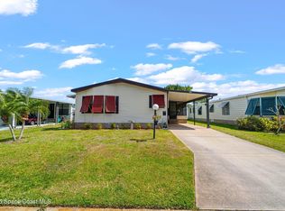 706 Hyacinth Cir, Barefoot Bay, FL 32976
