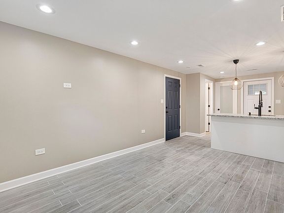 View of the entrance way and kitchen from the living room