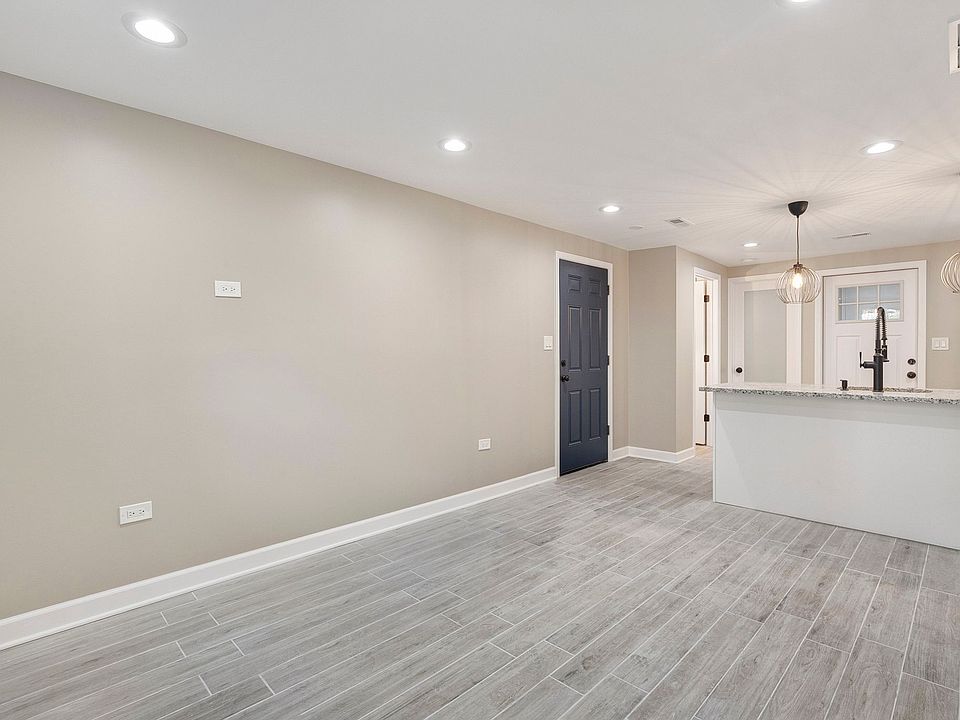 View of the entrance way and kitchen from the living room