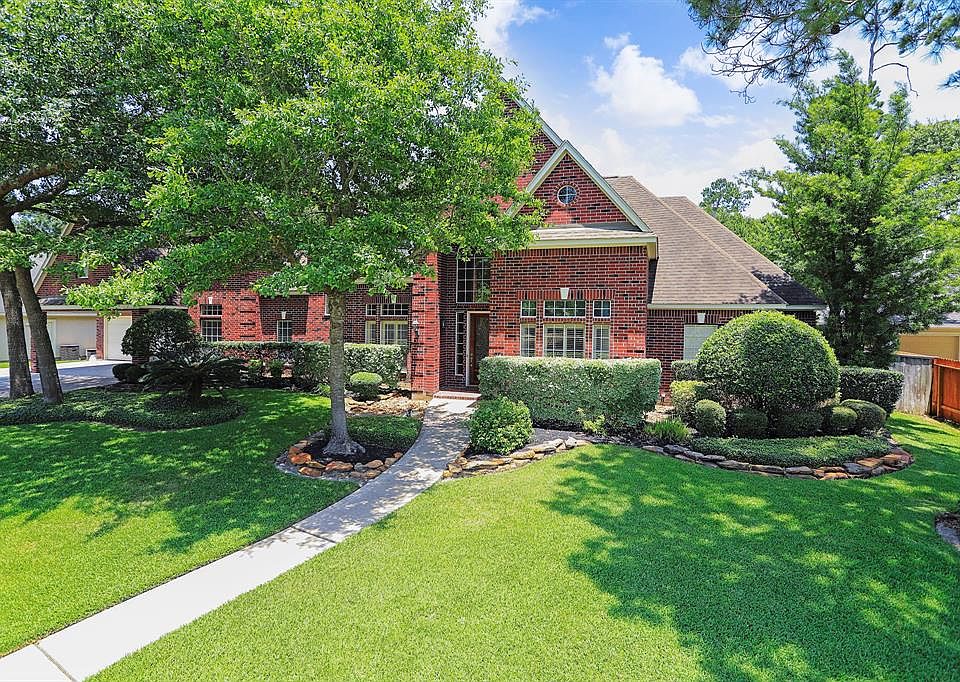 Beautiful curb appeal with red clad brick exterior on oversized lot.