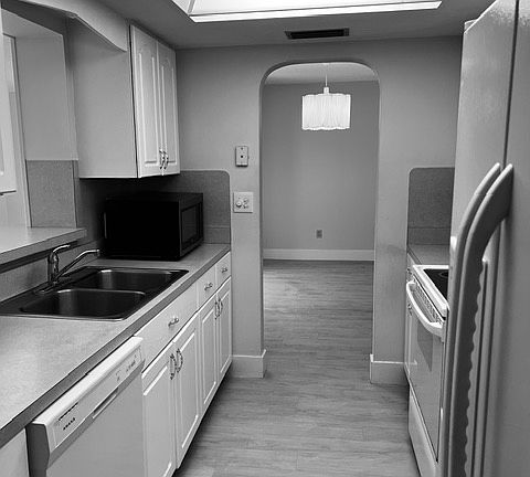 Galley kitchen connected to garage