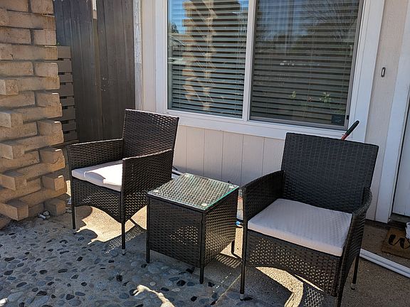 Private front yard with patio furniture