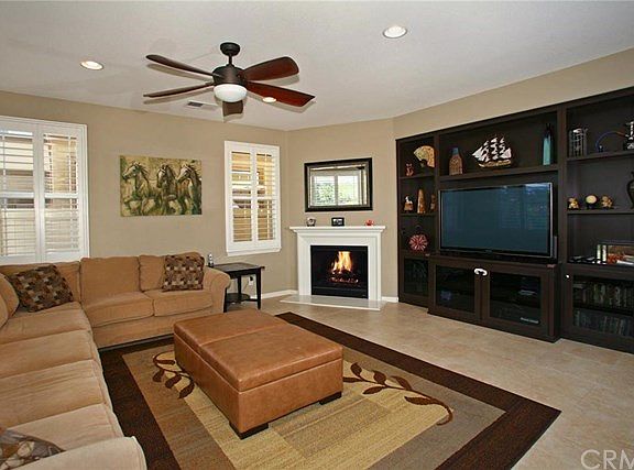 Another view of family room with fireplace and built-ins.