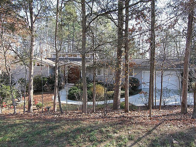 Long, low silhouette nestled in low maintenance yard