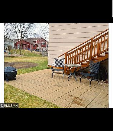 Paver Patio below large Deck.