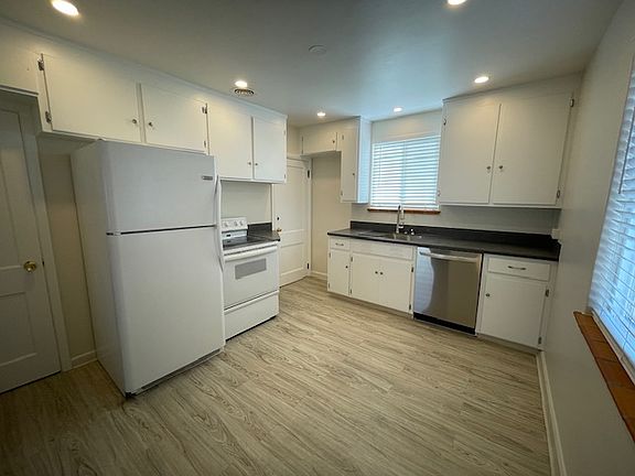 Newly remodeled kitchen with brand new dishwasher and countertops, lighting, sink, lots of storage, walk-in pantry, etc.
