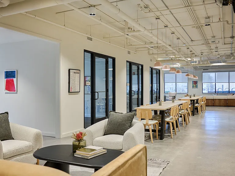 Community co-working area with private meeting rooms and offices