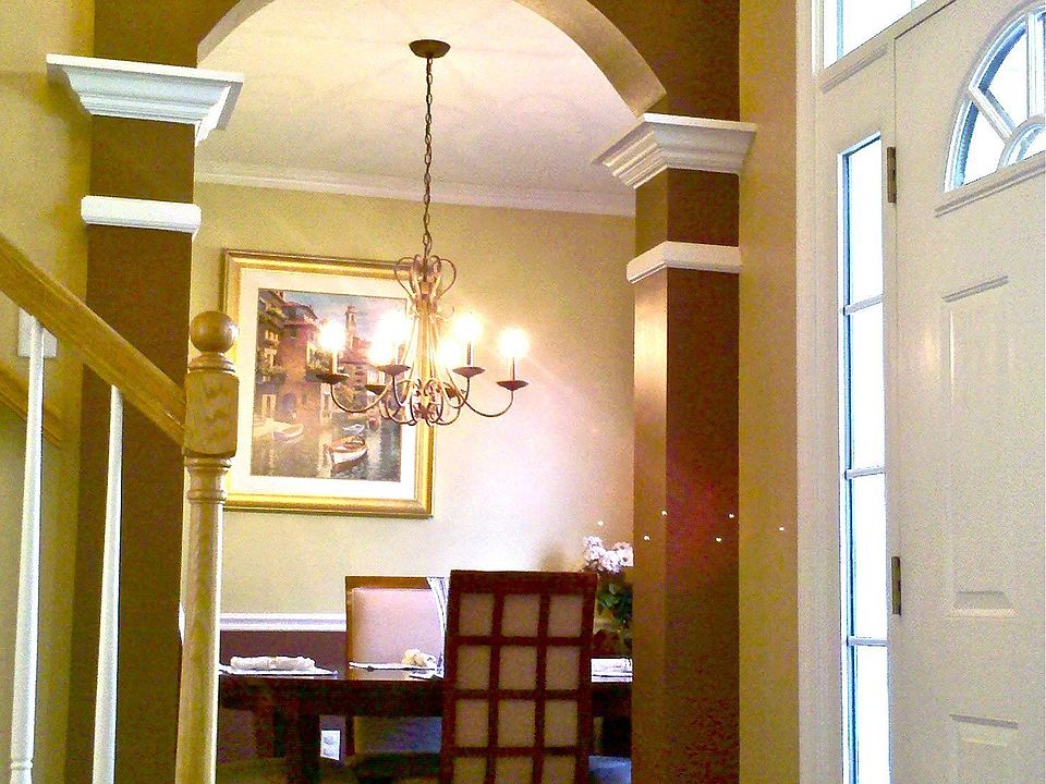 trim detail and arches in 2 story foyer