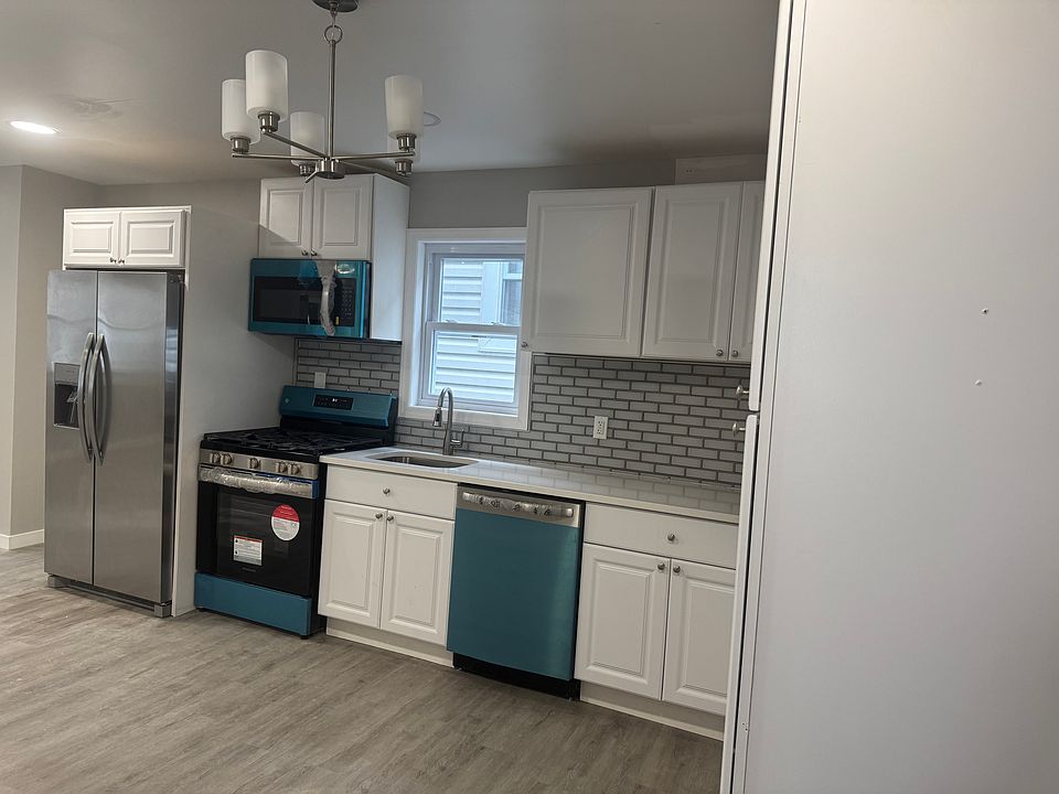 kitchen large with brand new appliances.
