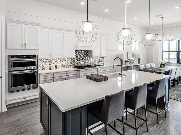 Kitchen with Large Center Island with Glass Tile Backslash