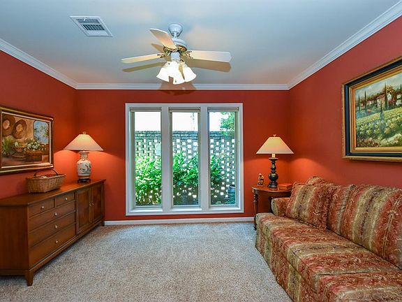 Bring the outdoors in with the fabulous views of the garden through the oversized windows. A great room for relaxing after a long day.