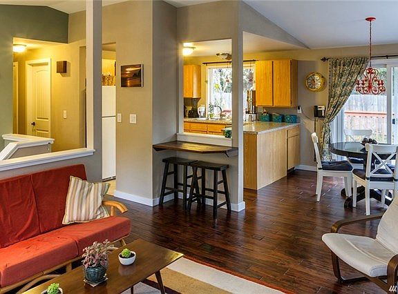 View from the corner of the upstairs living room. Beautiful new engineered hardwood floors throughout upstairs.