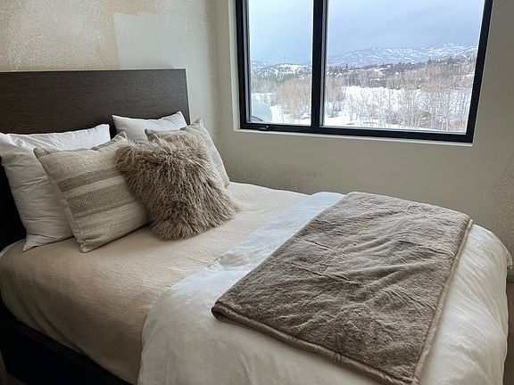 Upstairs bedroom with view of Golf Course. Room includes RH Ligne Bedroom collection including a day bed for lounging.