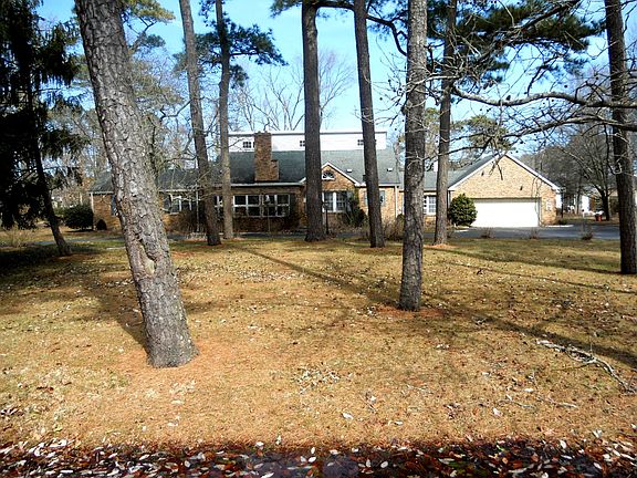 Natural landscaping surrounds this lovely home!