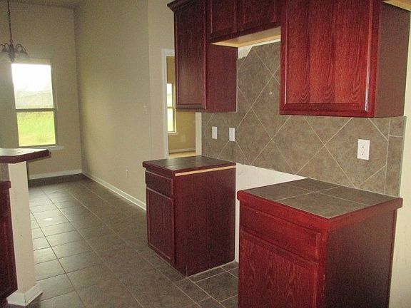 kitchen view to dining area, main bedroom - stove and micro/hood is missing
