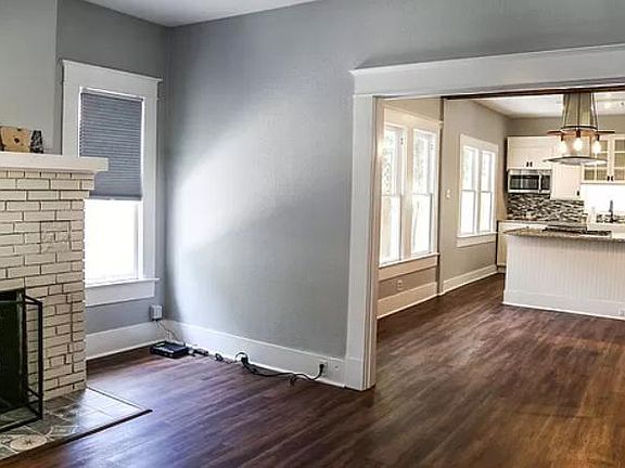 Open concept kitchen to dining to living areas