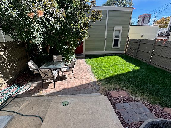 Fenced Back Yard and spacious two car garage in backround