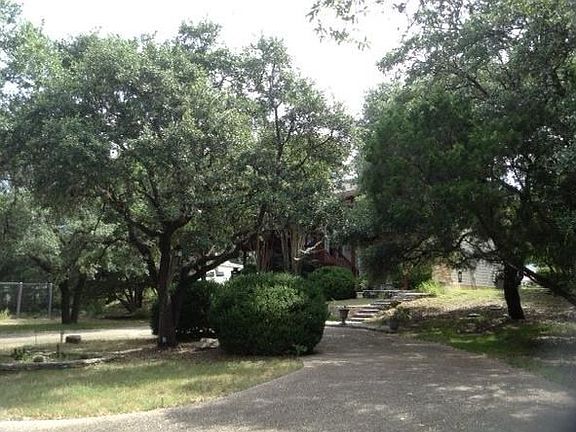 A circular drive leads up to the house, which is on a cul de