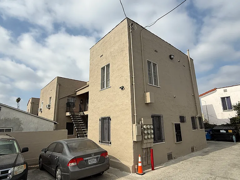 Parking Area and Rear Entrance To Unit