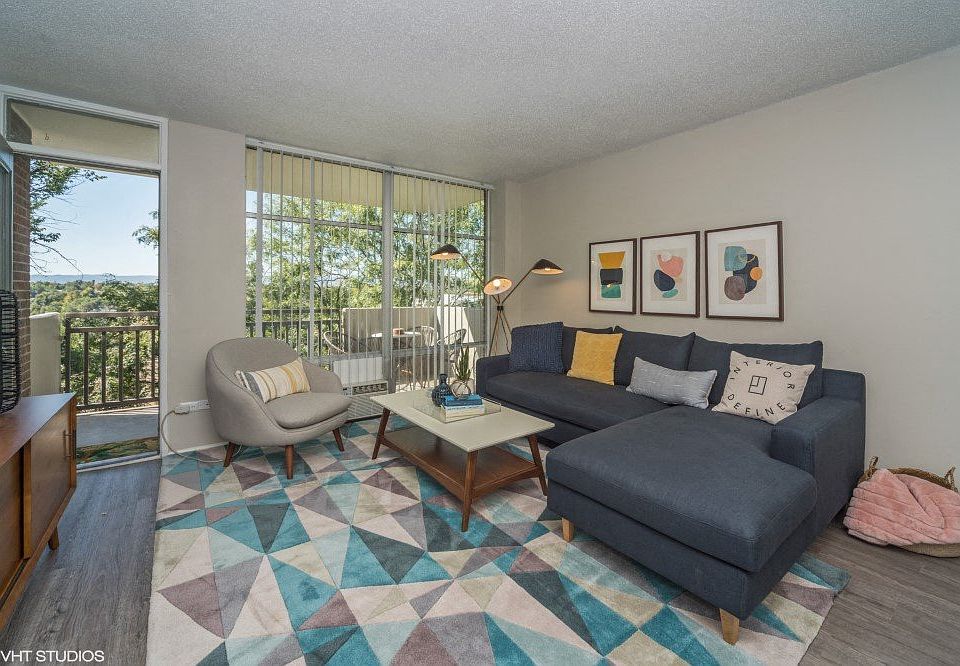 Spacious living room with natural lighting and balcony access