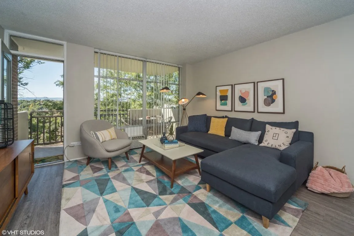 Spacious living room with natural lighting and balcony access