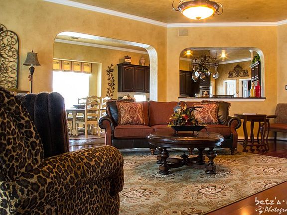 Den is open and warmed by the beautiful hard wood floor