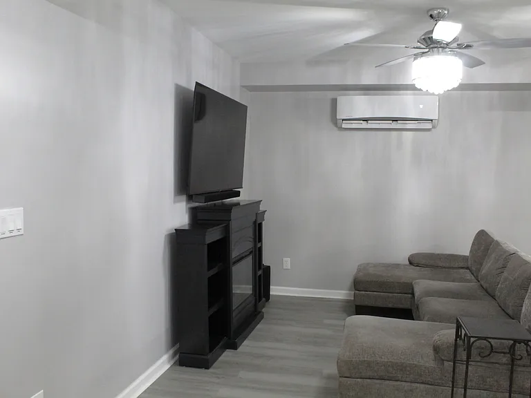Enjoy movie nights with the 65" TV and soundbar system.
