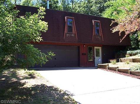 This home has a style of all its own, and so much more room than you can imagine, Several new up dates,just done in JULY,SUCH AS ROOMS HAVE ALL BEEN FRESHLY PAINTED, ALL NEW FLOORING, GARAGE DOOR PAINTED. This home is in the city, but you would think you were in the country,with its very private setting and only a few blocks from the school. There is a master bedroom and bath,2 other very large bedrooms, family room with a bar, kitchen open to the living room, large screened in front porch, a very large bonus room with 2 different stairways, the basement has 3 hidden rooms,all dry walled, the list just goes on.Sellers will pay  $1200 bonus to brokers selling agent if sold by Oct.31th.2013. If the electric heating system is a concern, sellers will help with cost of installing a  new forced- air natural gas furnace system in home