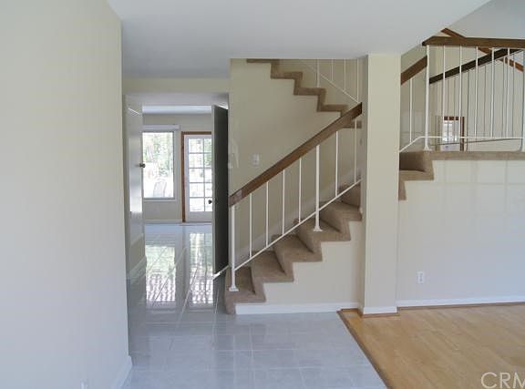 Entry with tile floor .