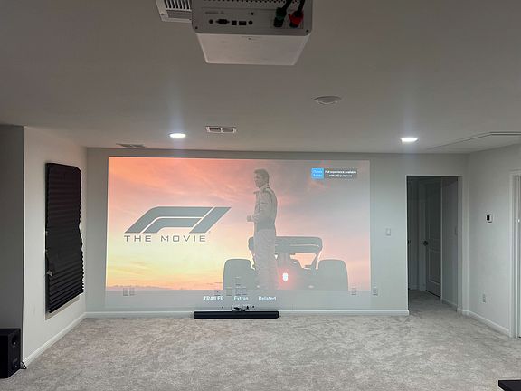 Game room converted to media room with huge screen