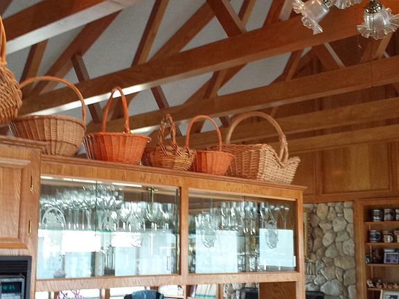 View from Kitchen to Living area. Keep an eye on all while you cook! Many windows too.