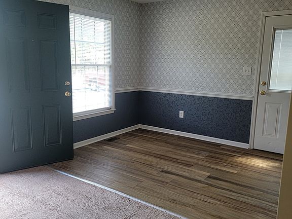 DINING ROOM OPENING TO THE GREAT ROOM