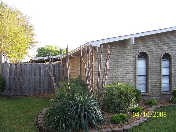 notice awning over patio behind fence