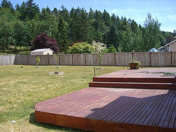 Huge fenced backyard with peaceful greenbelt behind