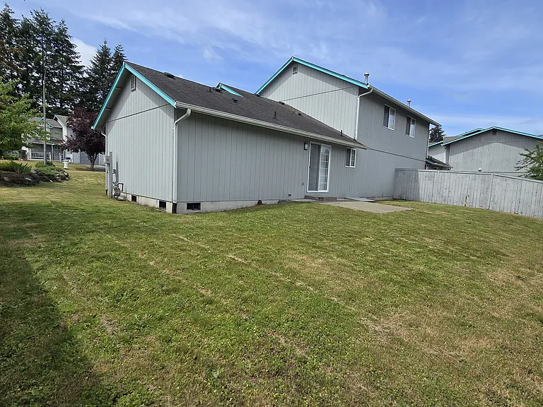 Wow! A HUGE backyard that is partially fenced, plus a patio space.