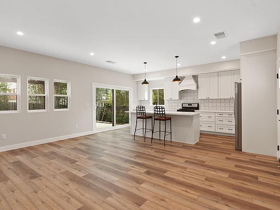 Open concept with kitchen and living room. Large island.